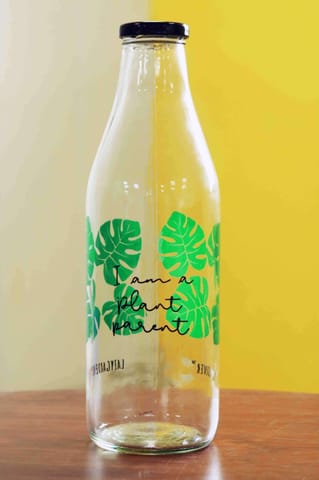 https://cdn.shopify.com/s/files/1/0089/7672/8119/products/i-am-a-plant-parent-printed-glass-bottle-1000ml-printed-glass-bottle-1000-ml-lazygardener-779595.jpg?v=1614262259