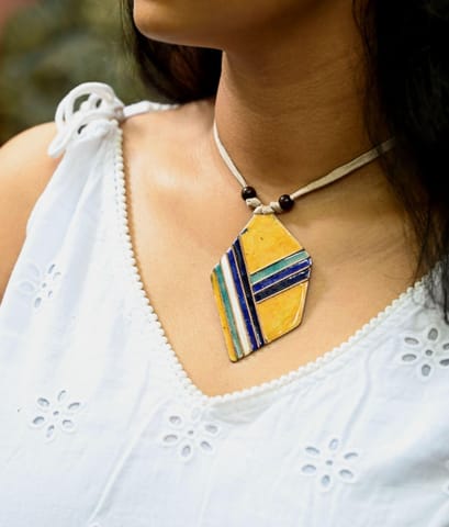 https://cdn.shopify.com/s/files/1/0649/5358/1790/products/Retro-Asymmetrical-Ekibeki-Copper-Enamel-Pendant-1.jpg?v=1670451383