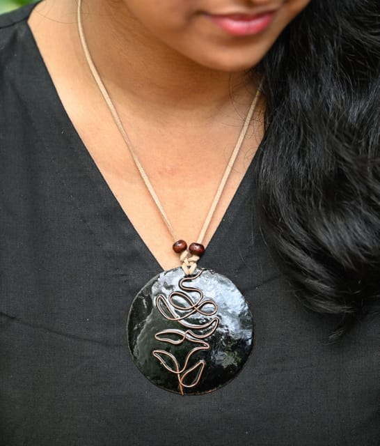 https://cdn.shopify.com/s/files/1/0649/5358/1790/products/Ekibeki-Black-Rose-copper-enamel-Pendant-1.jpg?v=1659294765