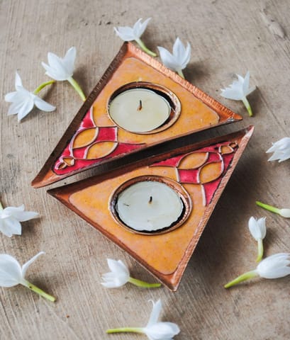 https://cdn.shopify.com/s/files/1/0649/5358/1790/products/Ekibeki-yellow-Rangoli-handmade-Tealight-Holder-Set-of-2_2.jpg?v=1665914391