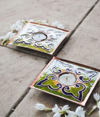 https://cdn.shopify.com/s/files/1/0649/5358/1790/products/Ekibeki-parrot-Rangoli-copper-enameled-handmade-square-Tealight-Holder-Set-of-2_2.jpg?v=1665918128