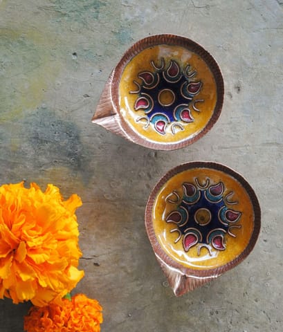 https://cdn.shopify.com/s/files/1/0649/5358/1790/products/Ekibeki-Yellow-Copper-enamel-Set-of-2-handmade-diyas-1.jpg?v=1665908200