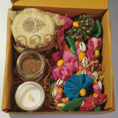 UMW - Eco Diwali Gift Box 1 | Upcycled Flower Toran | Soy Candle Jar | Dates Jar with Filling | Coffee & Orange Body Scrub