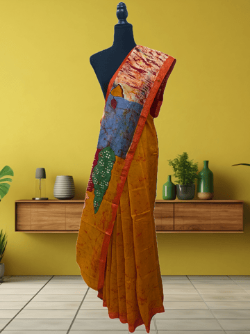 Anoothi-A Handpainted Batik Maheshwari Silk Cotton Saree in Orange