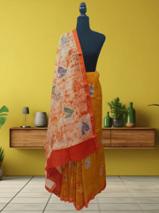 Anoothi-A Handpainted Batik Maheshwari Silk Cotton Saree in Orange and Cream